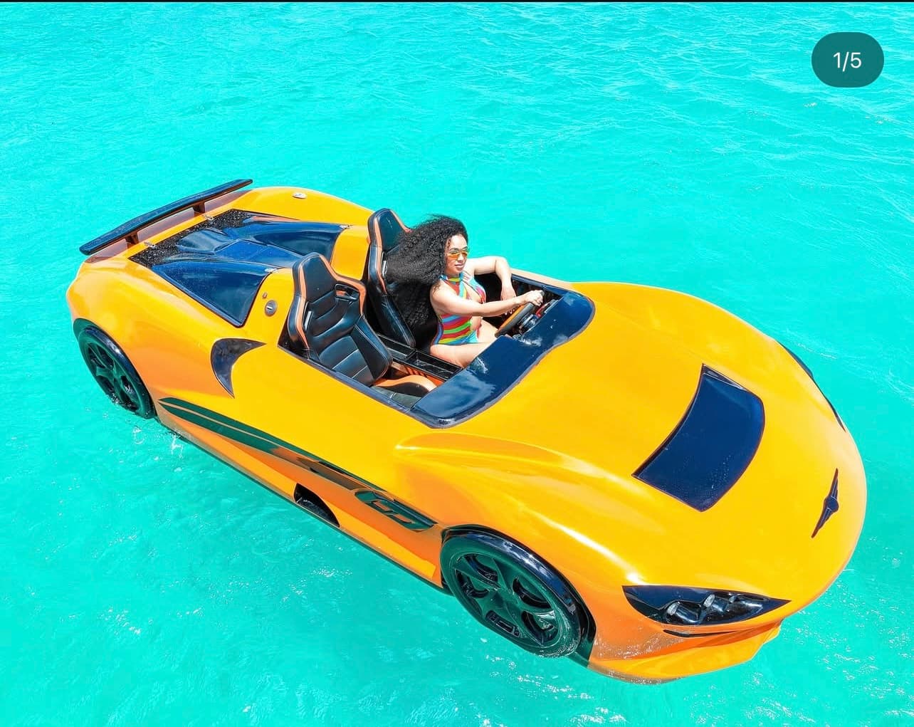 Amphibious sports car on turquoise water